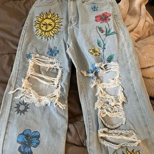 flowers and suns ripped baggy jeans